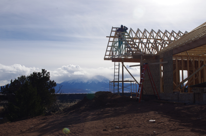decking Comanche home with mountains in backgroun